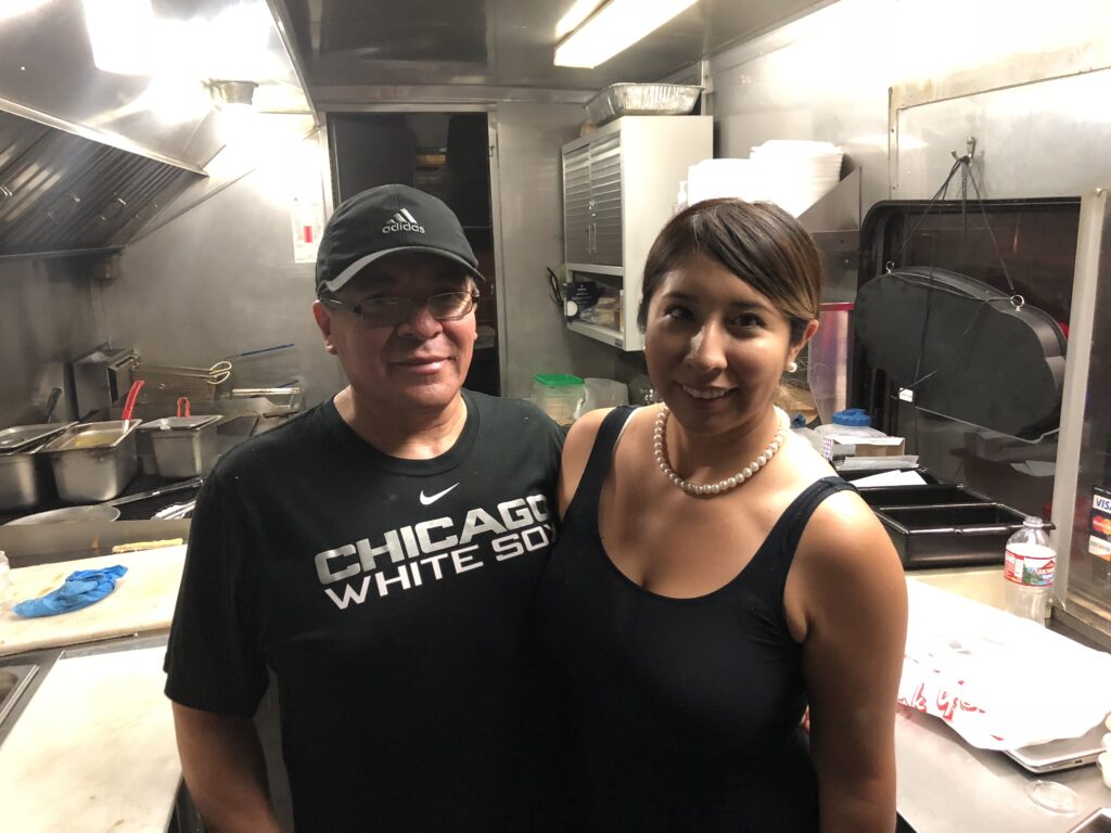 Ruben Hernandez and his daughter in Ruby's Taco Truck