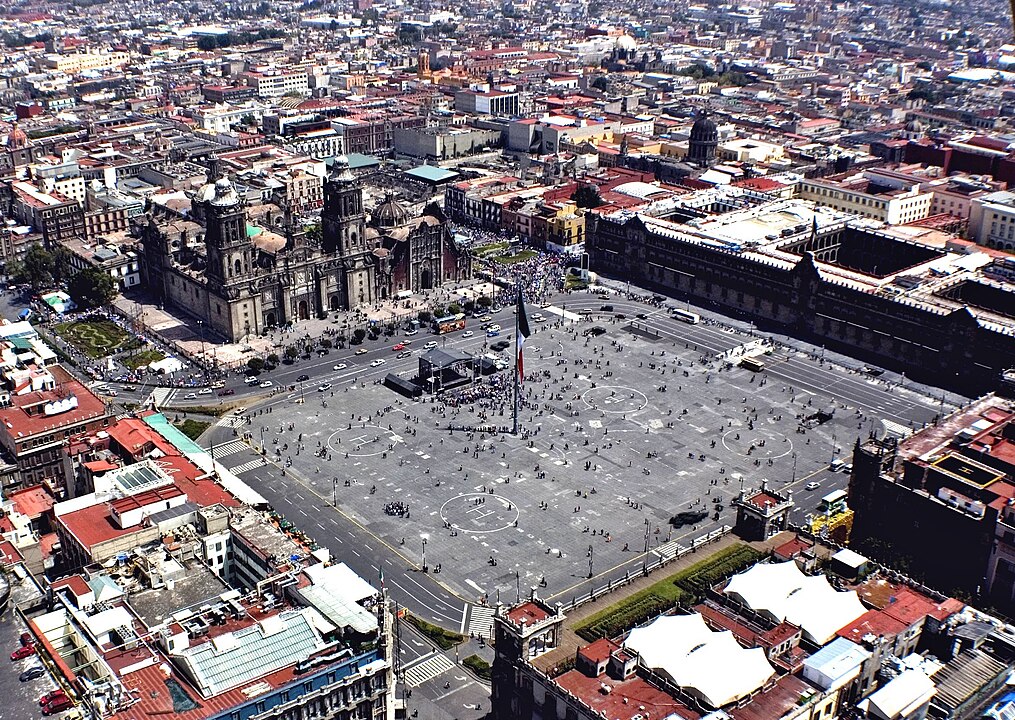 Aerial perspective of the Cathedral and the Zócalo in Mexico City, showcasing the grandeur and historical significance of these iconic landmarks amidst the urban tapestry.