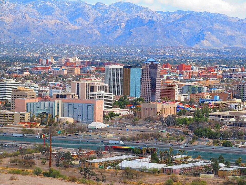 Panoramic view of Downtown Tucson, Arizona, with its urban skyline and expansive landscapes, as seen from the vantage of Sentinel Peak.