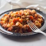 Traditional Mexican Picadillo stew with meat, carrots, potatoes, and olives.